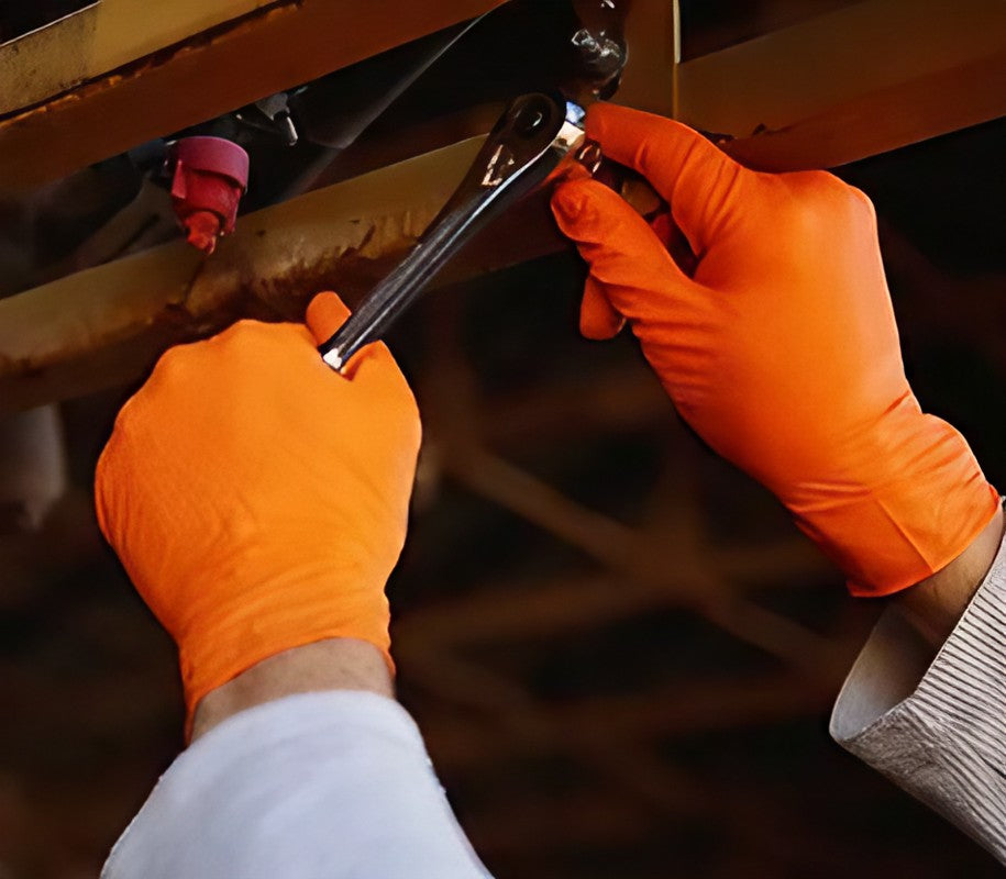 Novaguard Orange Nitrile Gloves being worn by a person, showcasing the product's fit and color